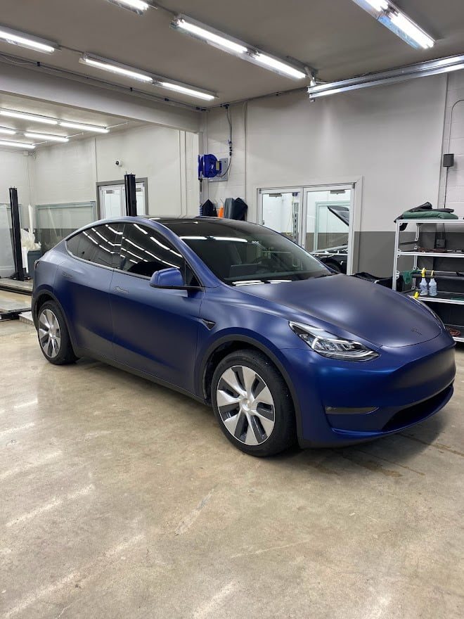 Blue Tesla Model Y in the bay