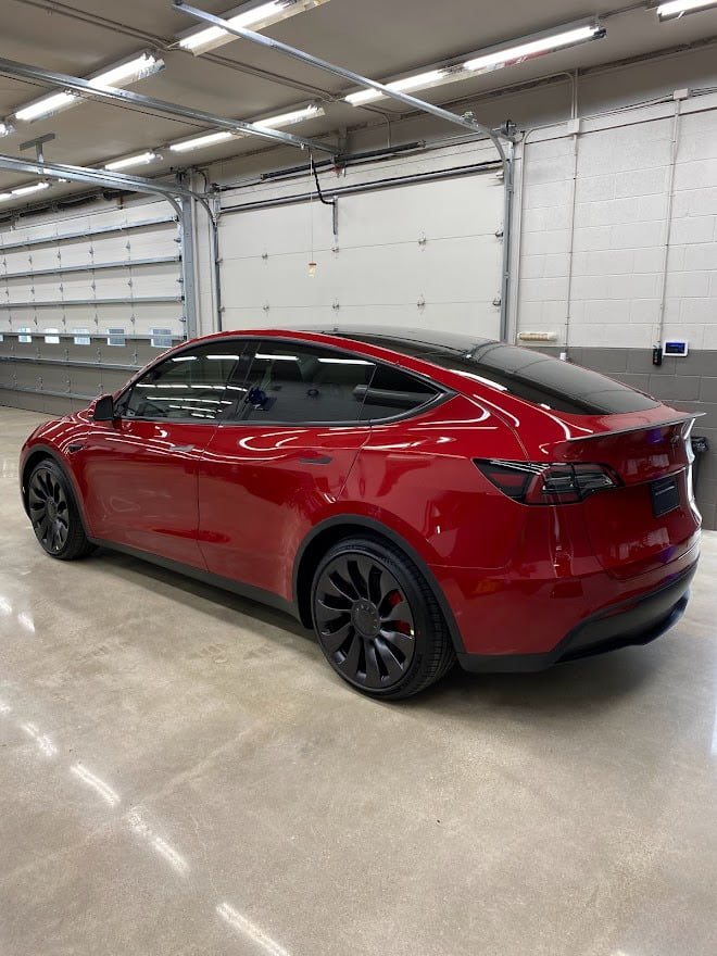 Red Tesla Model Y in the bay